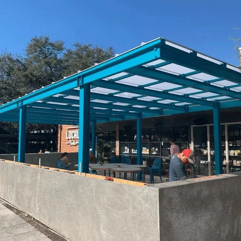 White pergola roof cover over a commercial patio