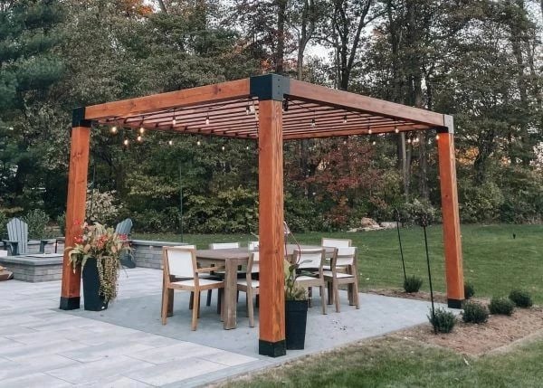 Modern Douglas fir pergola over a patio dining set